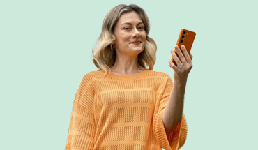 Lady holding an orange phone